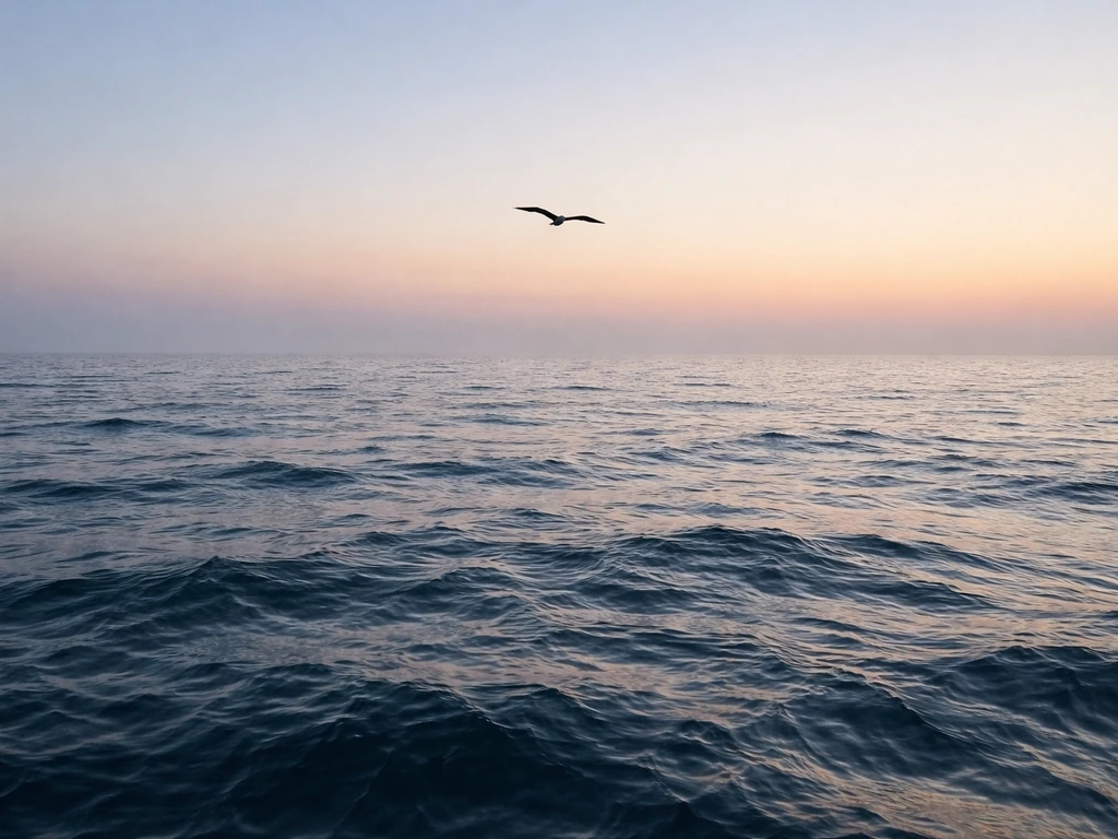 Black silhouette of a pelagic seabird gliding mid-flight over far open ocean waters